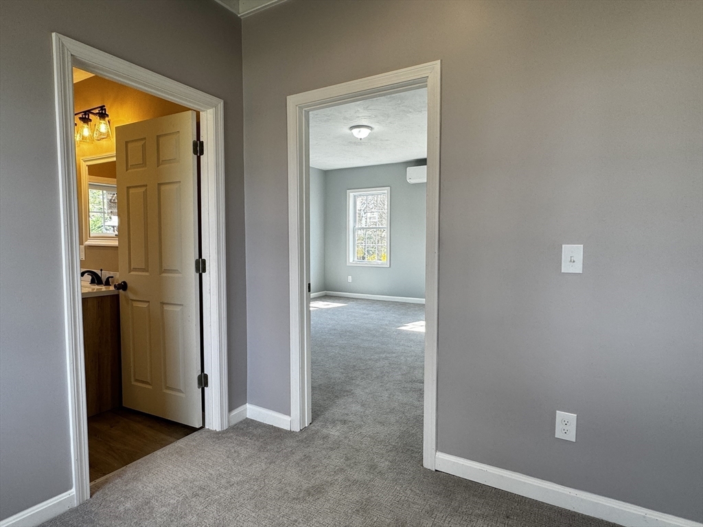 11 Main Street Brookfield, MA 01506 - Photo 19 of 29 an empty room with windows and closet