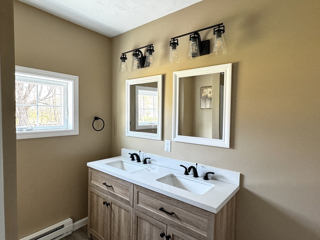 11 Main Street Brookfield, MA 01506 - Photo 20 of 29 a bathroom with a sink and a mirror