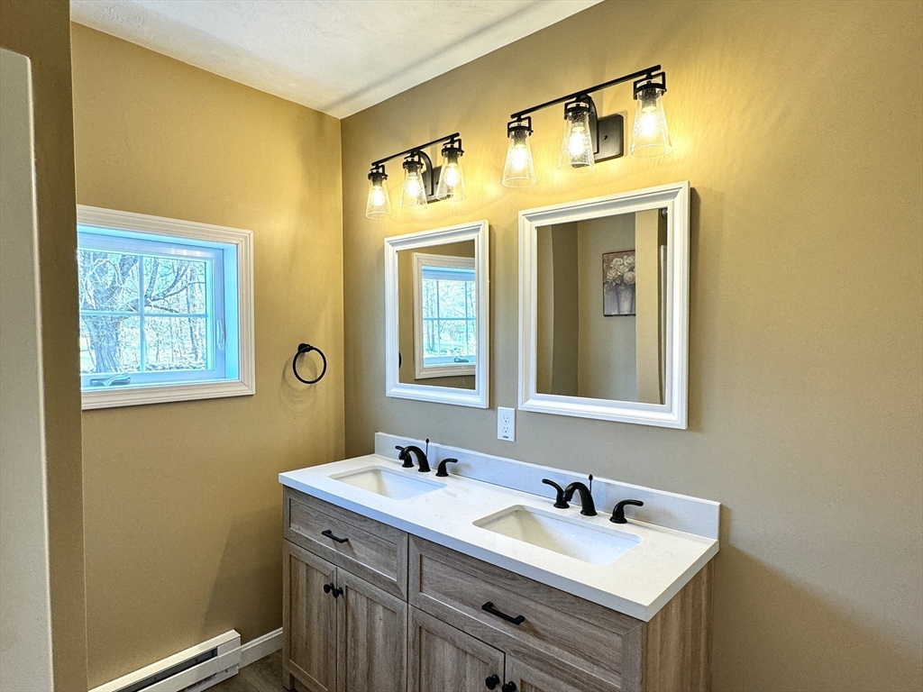 11 Main Street Brookfield, MA 01506 - Photo 21 of 29 a bathroom with a sink and a mirror