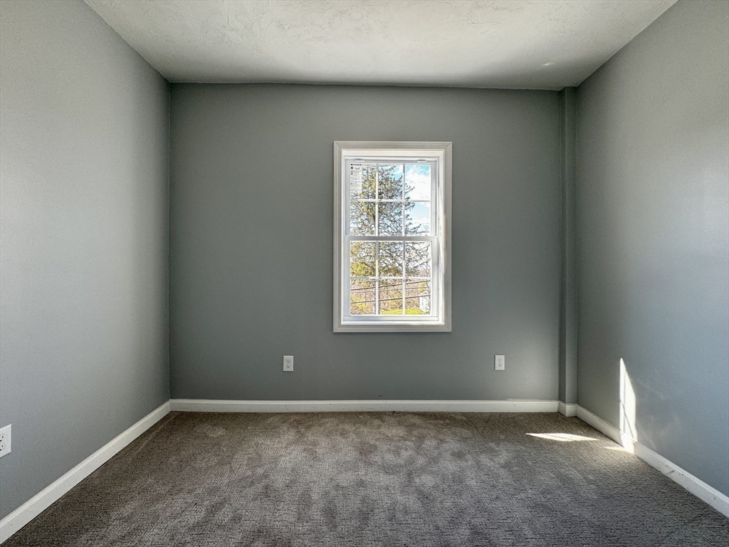 11 Main Street Brookfield, MA 01506 - Photo 23 of 29 an empty room with a window