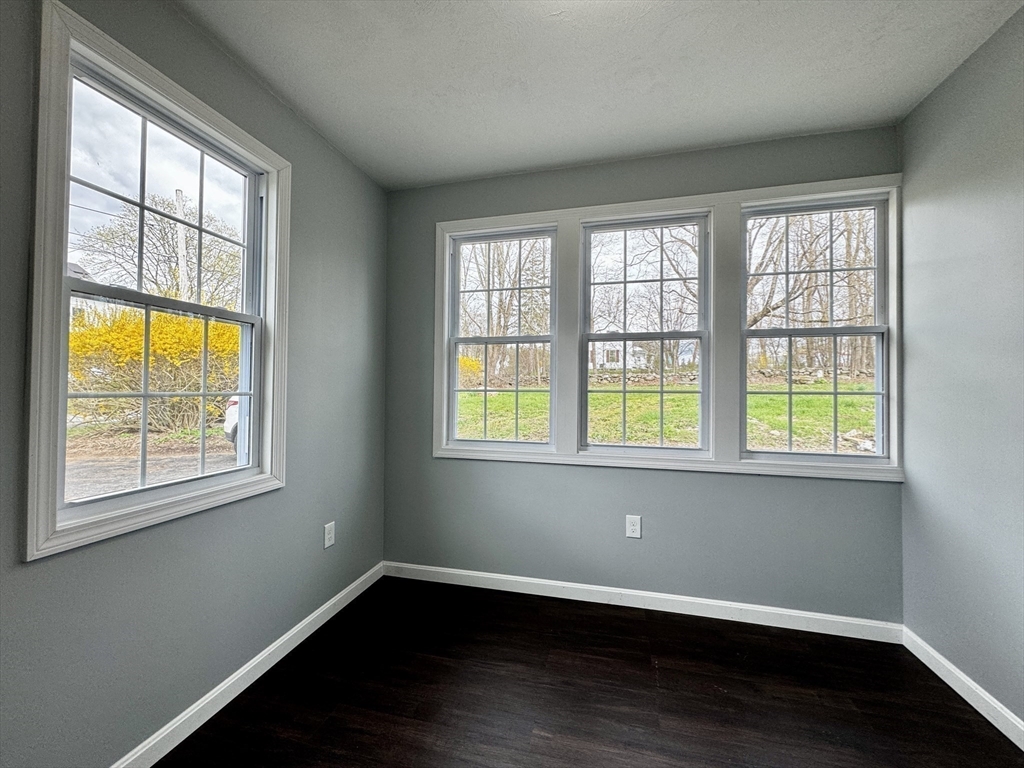 11 Main Street Brookfield, MA 01506 - Photo 26 of 29 a view of an empty room with wooden floor and a window