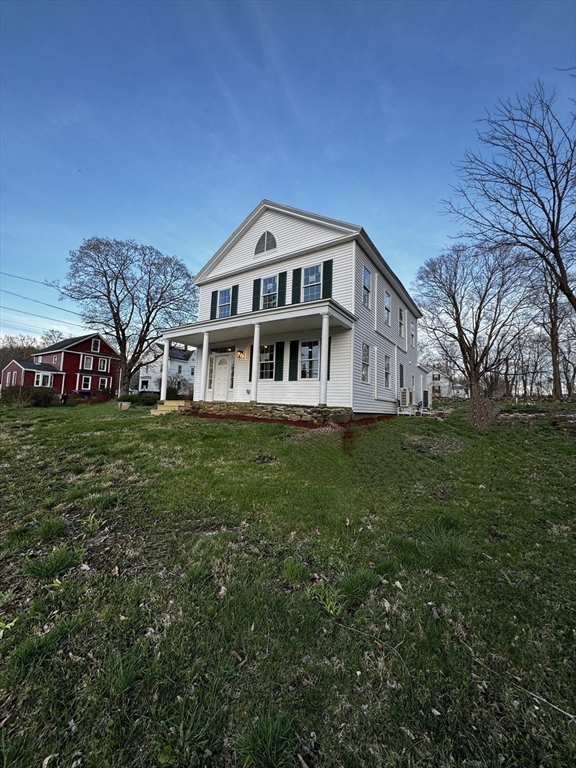11 Main Street Brookfield, MA 01506 - Photo 29 of 29 a front view of a house with a yard