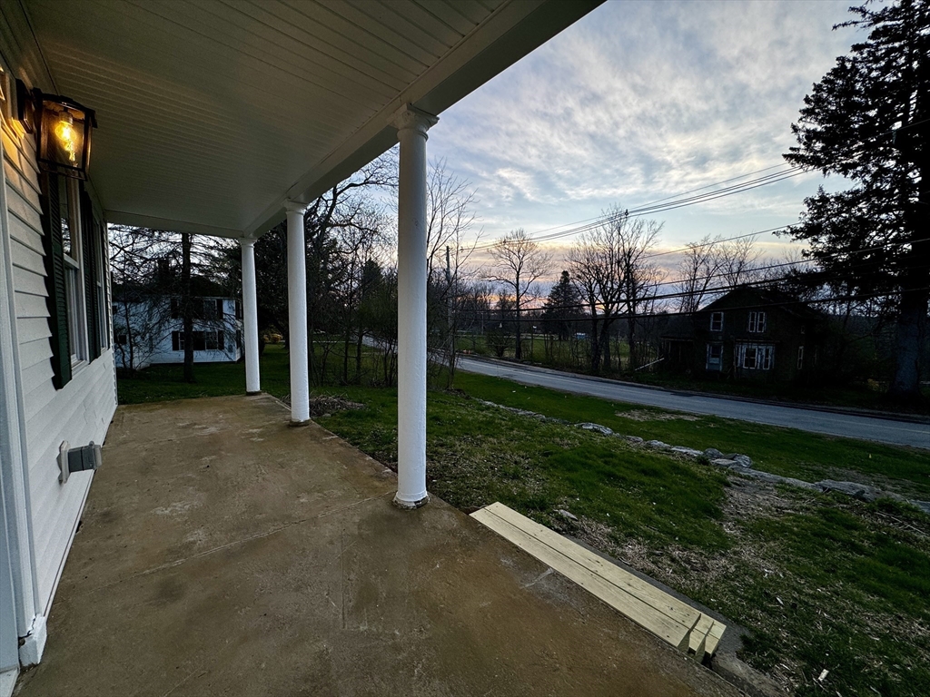 11 Main Street Brookfield, MA 01506 - Photo 4 of 29 a view of a porch with furniture and garden