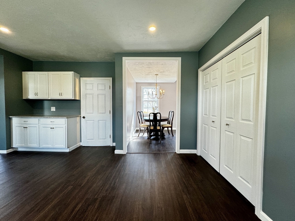 11 Main Street Brookfield, MA 01506 - Photo 10 of 29 a view of a hallway with wooden floor and furniture
