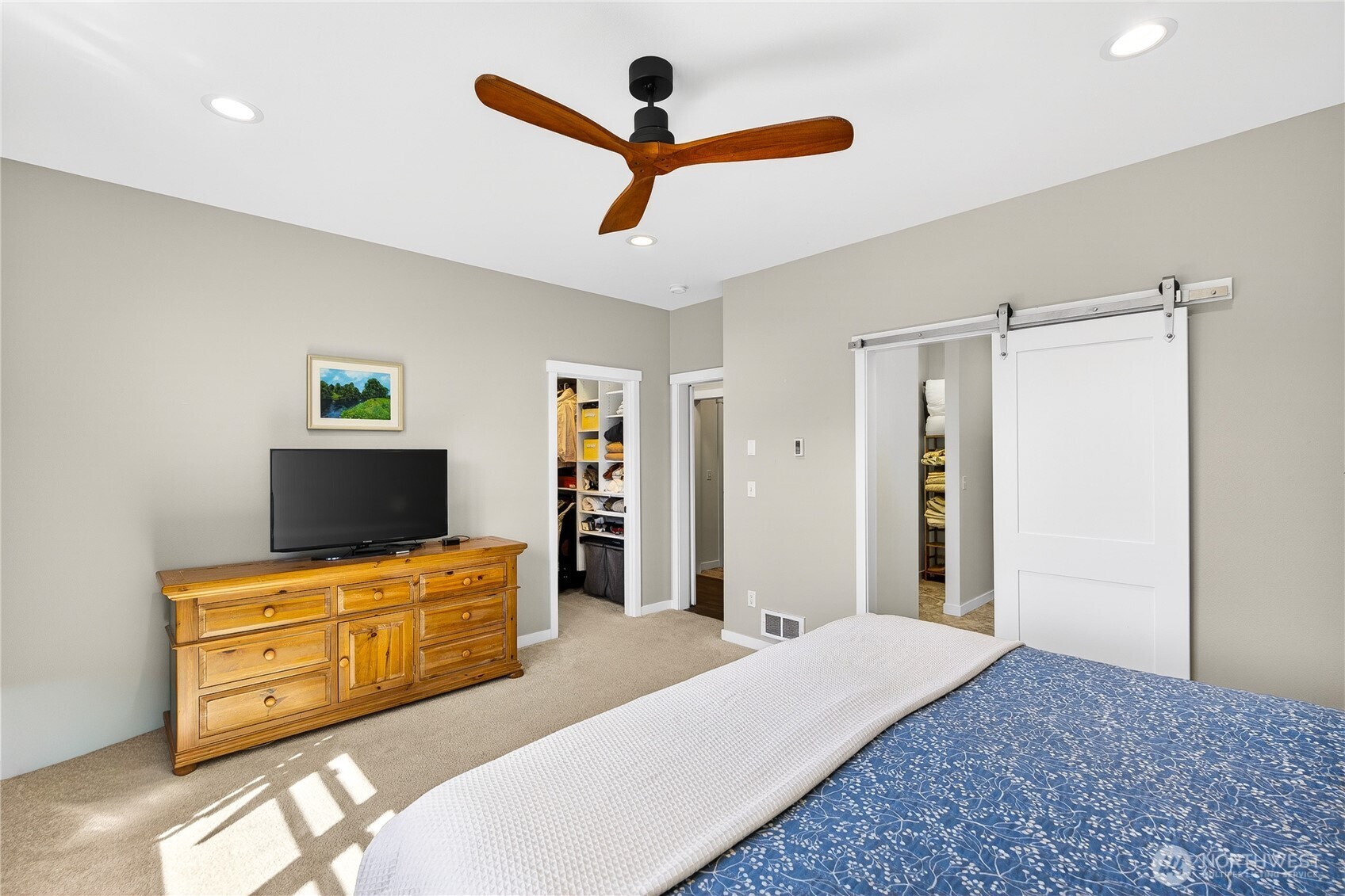 1268 Curtis Way Freeland, WA 98249 - Photo 18 of 40 a bedroom with a bed and furniture