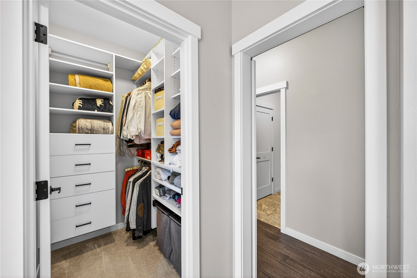 1268 Curtis Way Freeland, WA 98249 - Photo 20 of 40 a view of walk in closet with clothes and shoes
