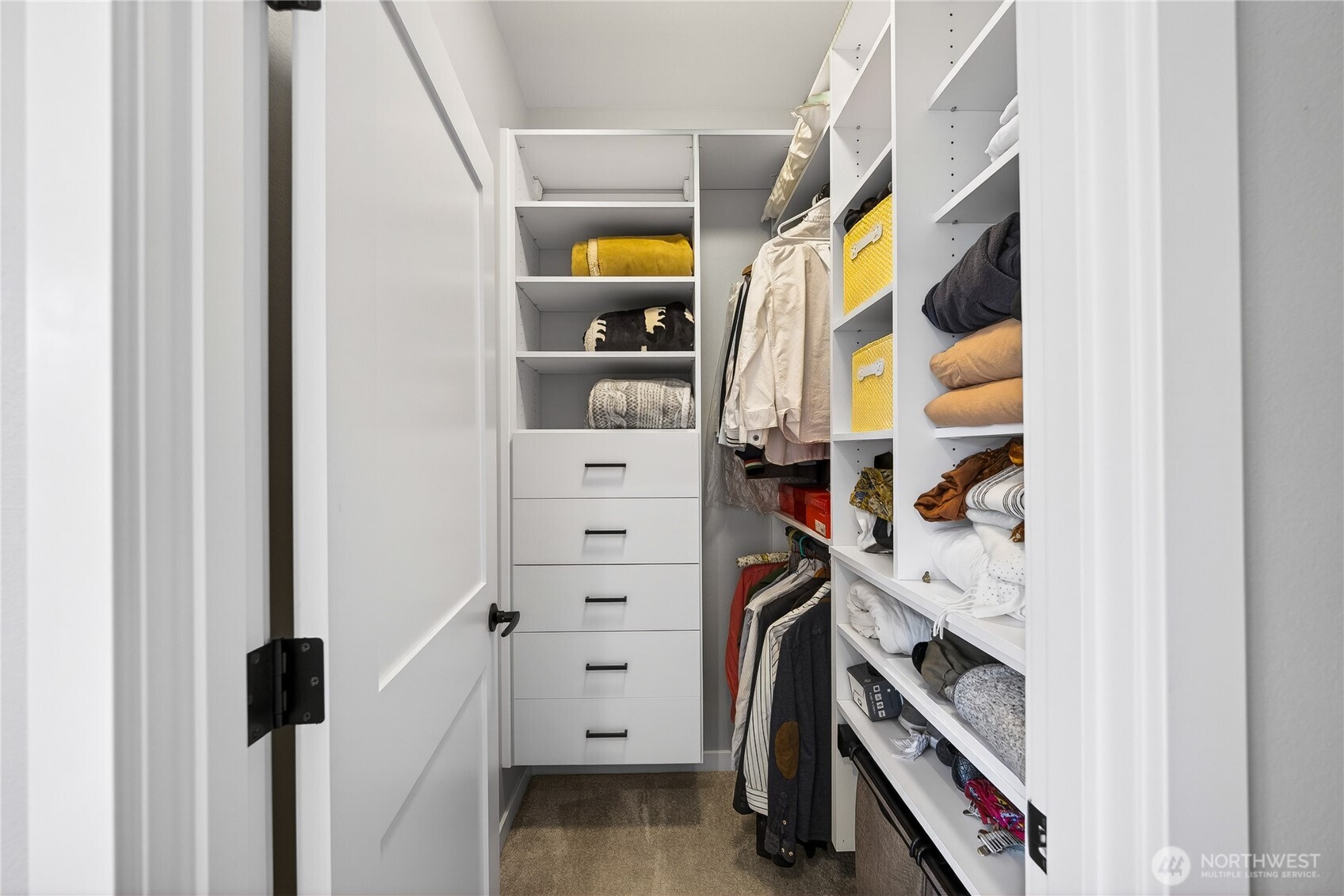 1268 Curtis Way Freeland, WA 98249 - Photo 21 of 40 a view of walk in closet with clothes and shoes