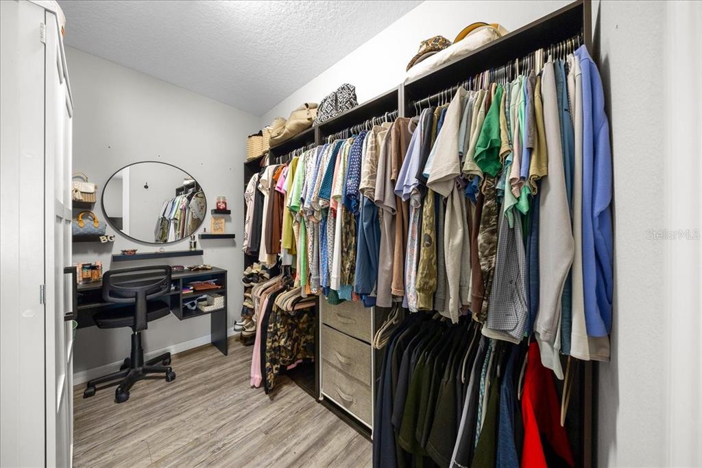 13 Teak Loop Place Ocala, FL 34472 - Photo 30 of 36 a view of walk in closet with clothes and shoes