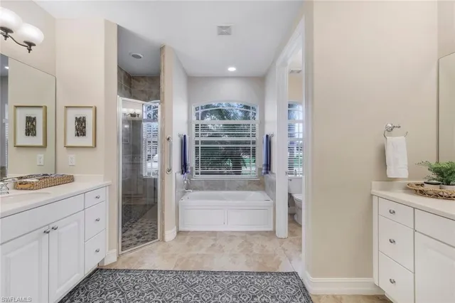 a view of kitchen with sink and refrigerator