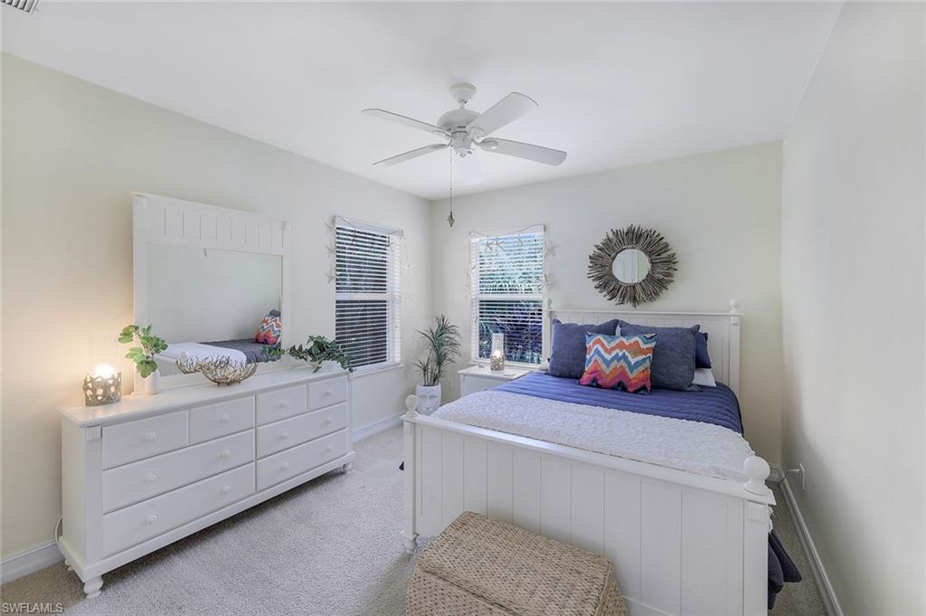 31 Tahiti Road Marco Island, FL 34145 - Photo 14 of 27 a bedroom with a bed and ceiling fan