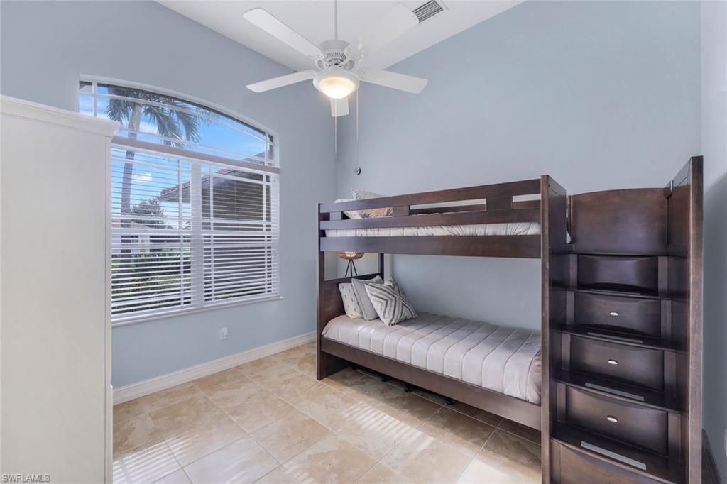 31 Tahiti Road Marco Island, FL 34145 - Photo 17 of 27 a living room with a couch and a ceiling fan