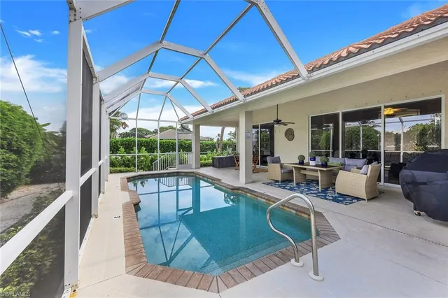 a view of a swimming pool with a patio
