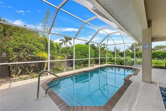 a view of a swimming pool with a porch