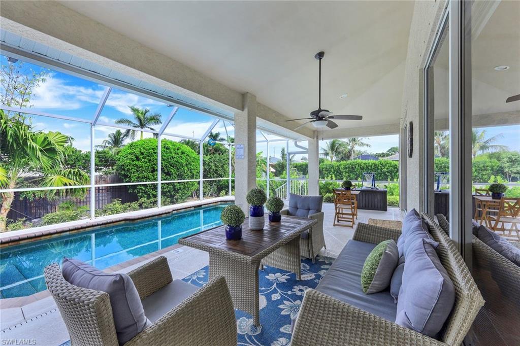 31 Tahiti Road Marco Island, FL 34145 - Photo 24 of 27 a living room with furniture and a large window