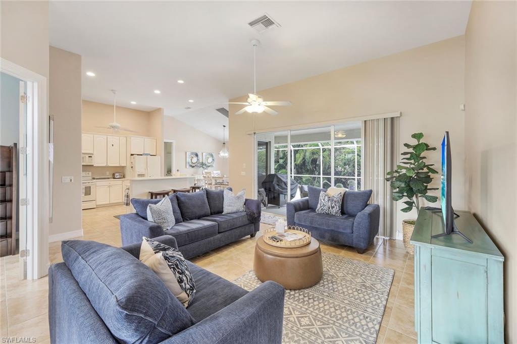 31 Tahiti Road Marco Island, FL 34145 - Photo 3 of 27 a living room with furniture and a large window