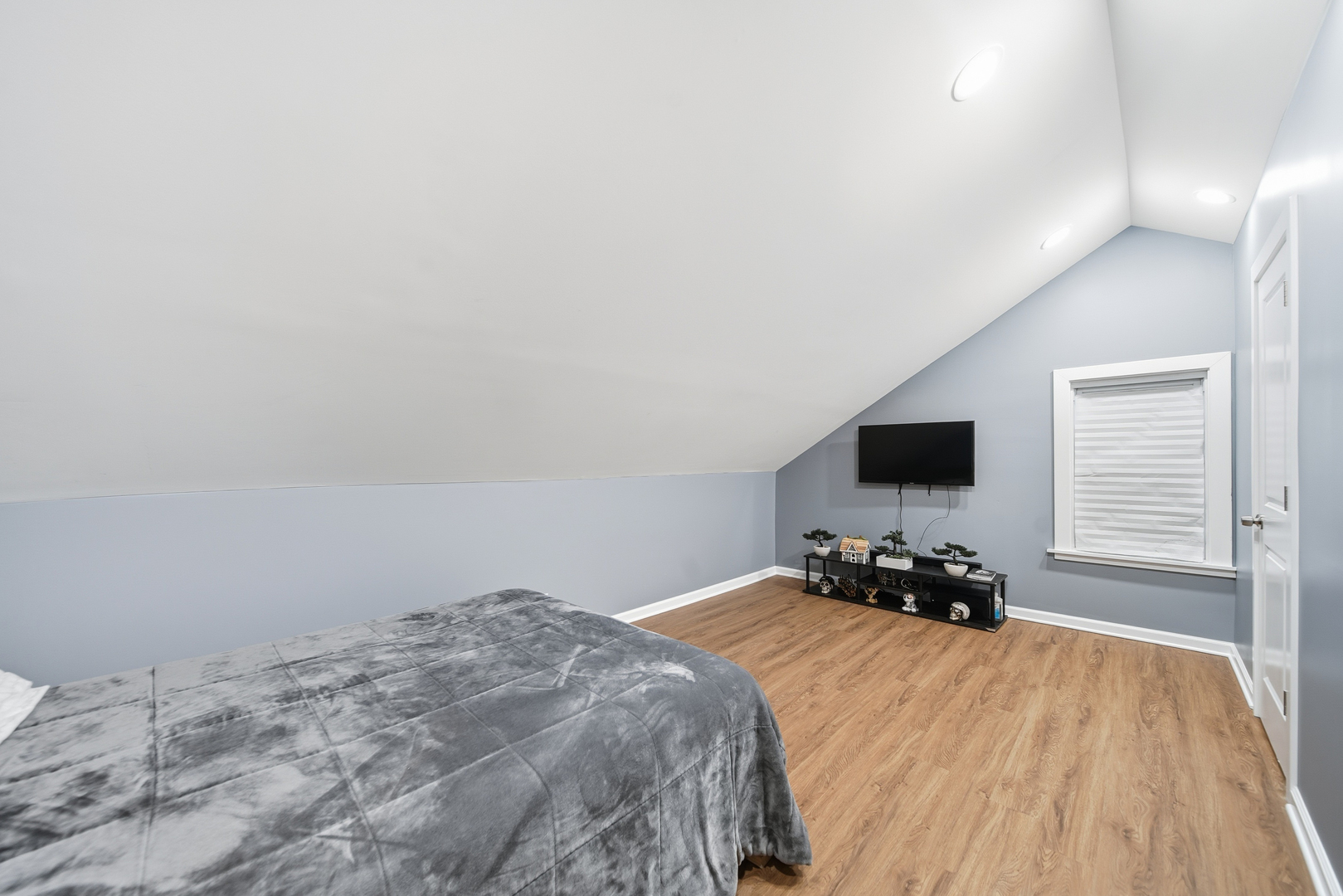 105 East Knox Street Morrison, IL 61270 - Photo 15 of 27 a bedroom with a bed and a flat tv screen on dresser