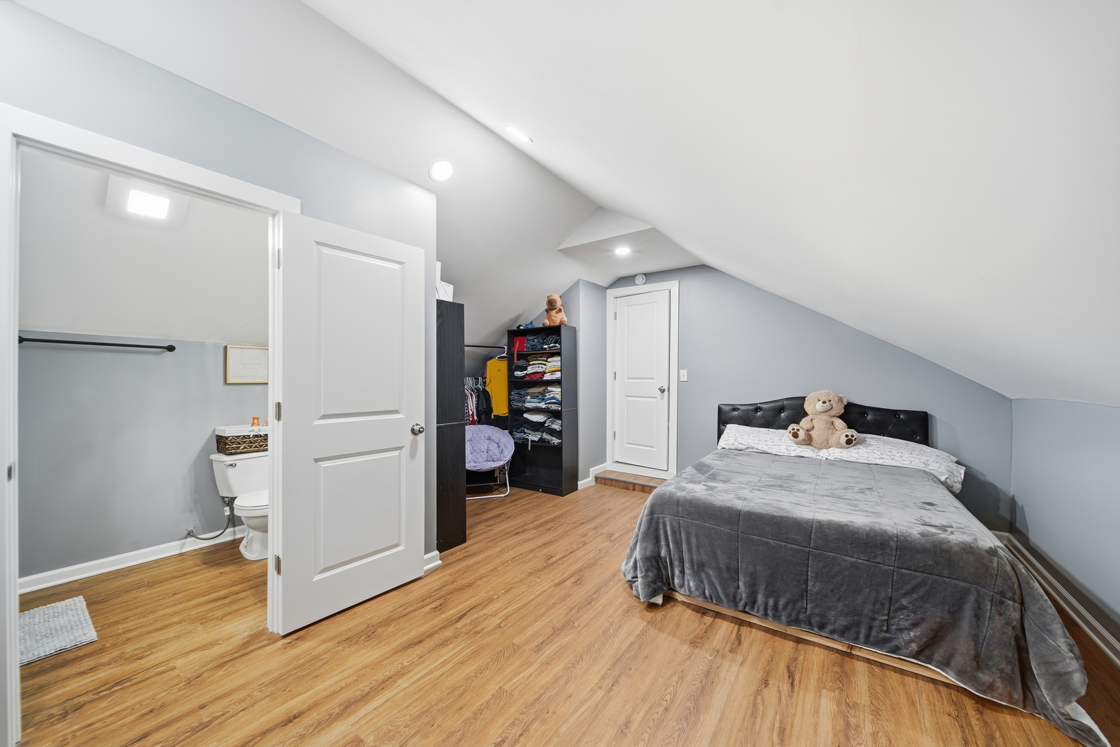 105 East Knox Street Morrison, IL 61270 - Photo 16 of 27 a bedroom with a bed and wooden floor