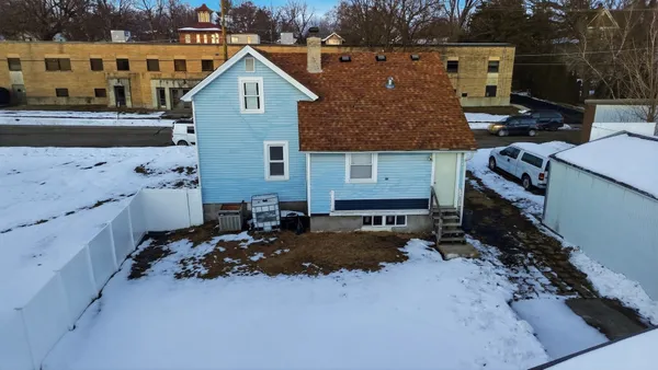 a aerial view of a house with a yard