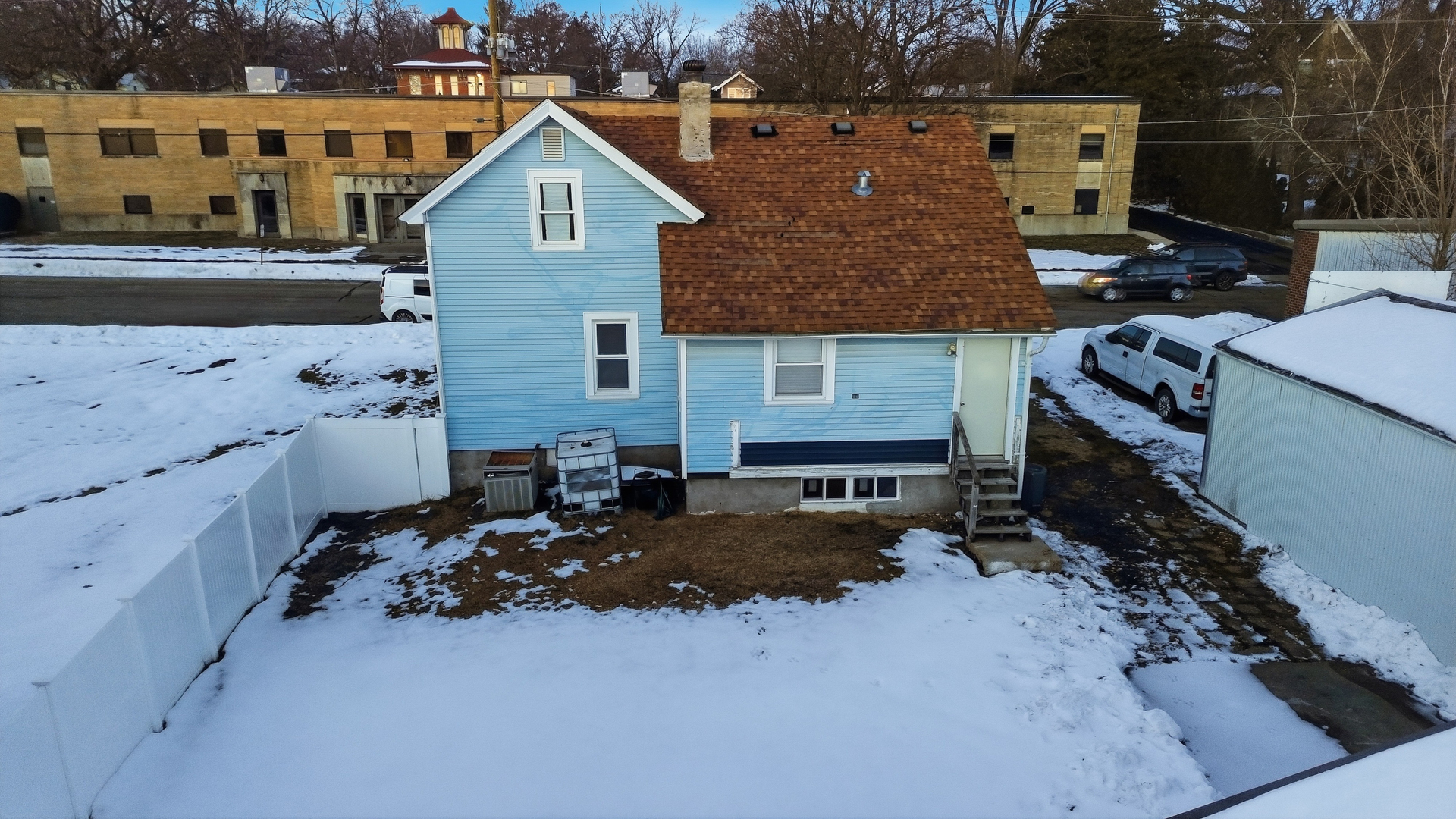 105 East Knox Street Morrison, IL 61270 - Photo 24 of 27 a aerial view of a house with a yard