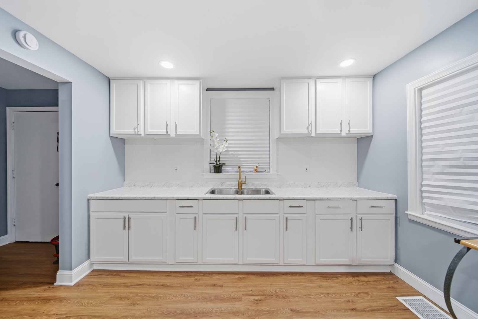 105 East Knox Street Morrison, IL 61270 - Photo 9 of 27 a kitchen with a sink cabinets and window