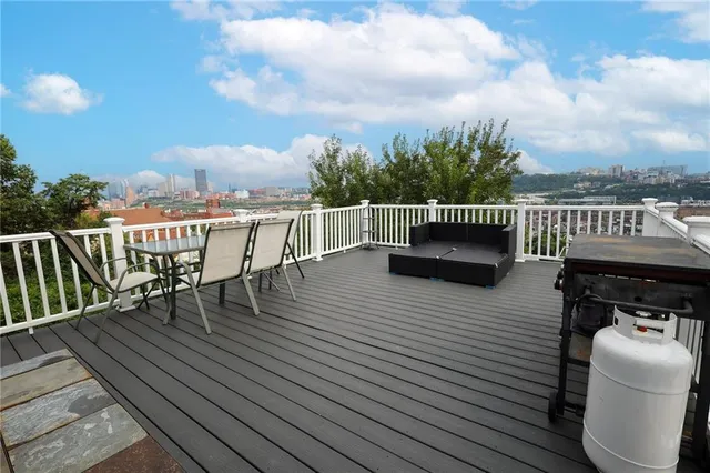 a view of a balcony with furniture