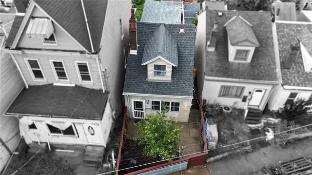 an aerial view of a house with swimming pool