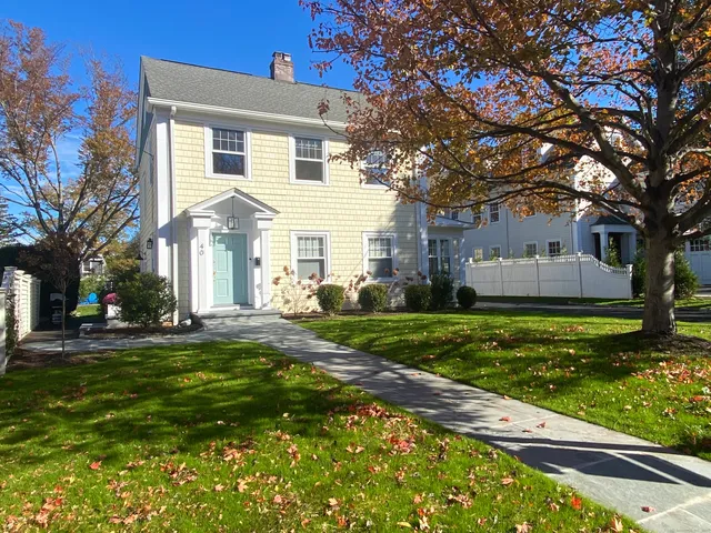 a front view of a house with a yard