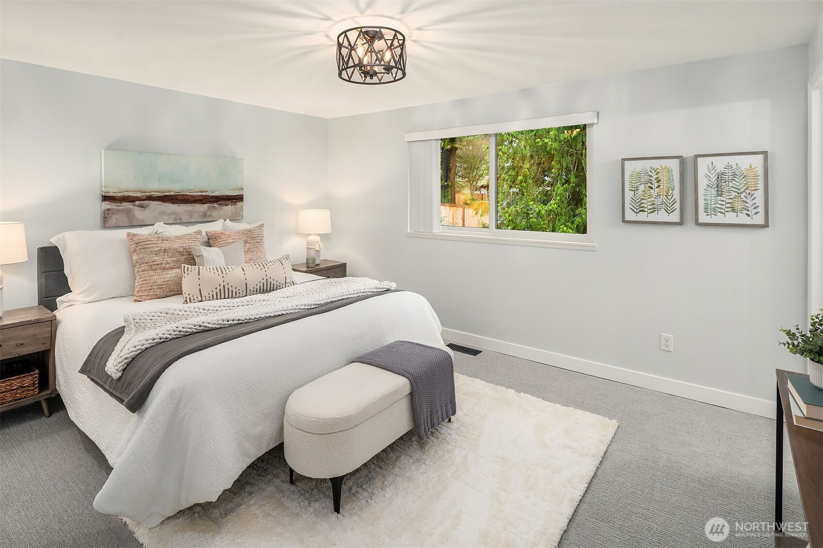10017 Northeast 202nd Street Bothell, WA 98011 - Photo 13 of 38 a bedroom with a bed and a painting on the wall