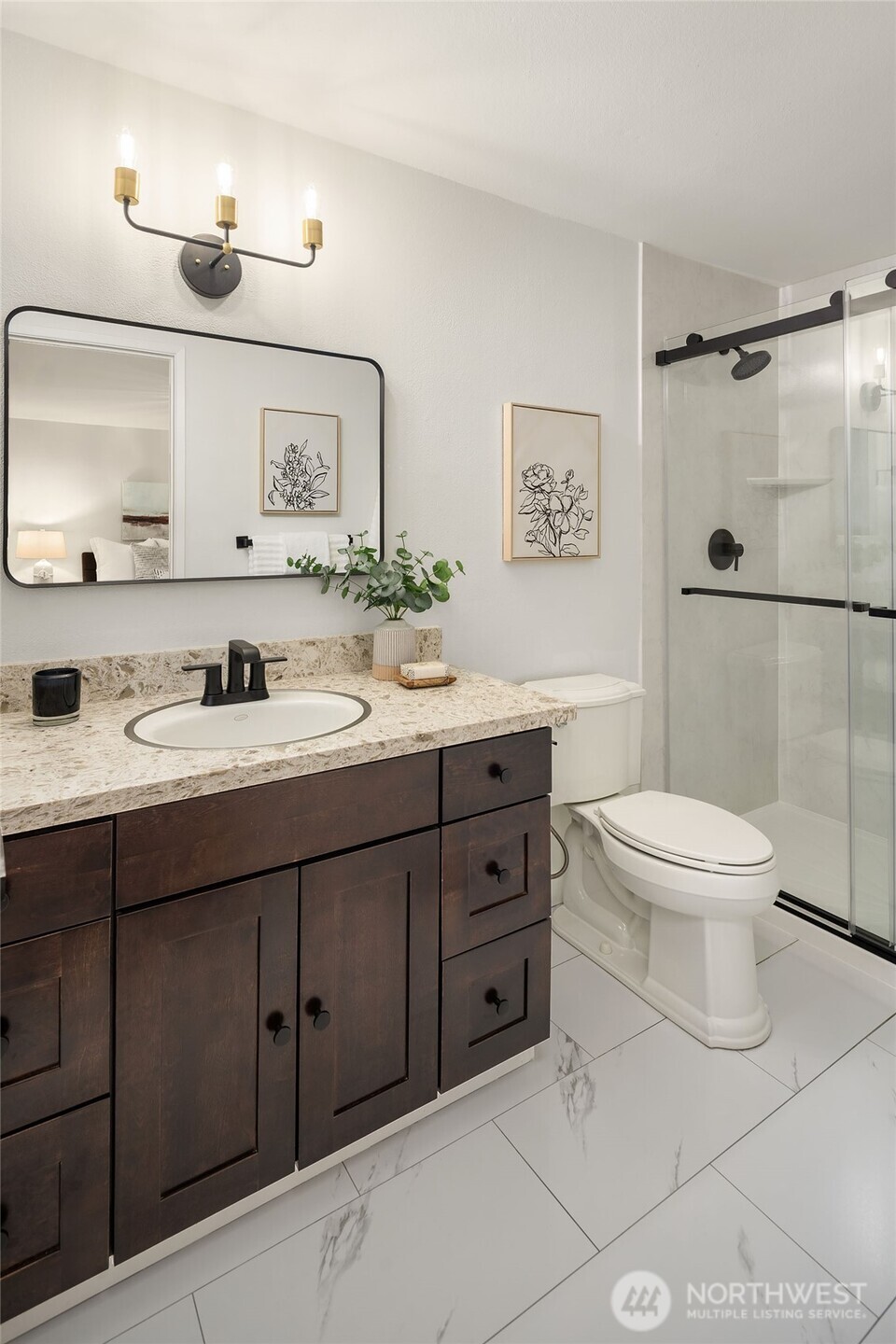 10017 Northeast 202nd Street Bothell, WA 98011 - Photo 14 of 38 a bathroom with a double vanity sink toilet mirror and shower