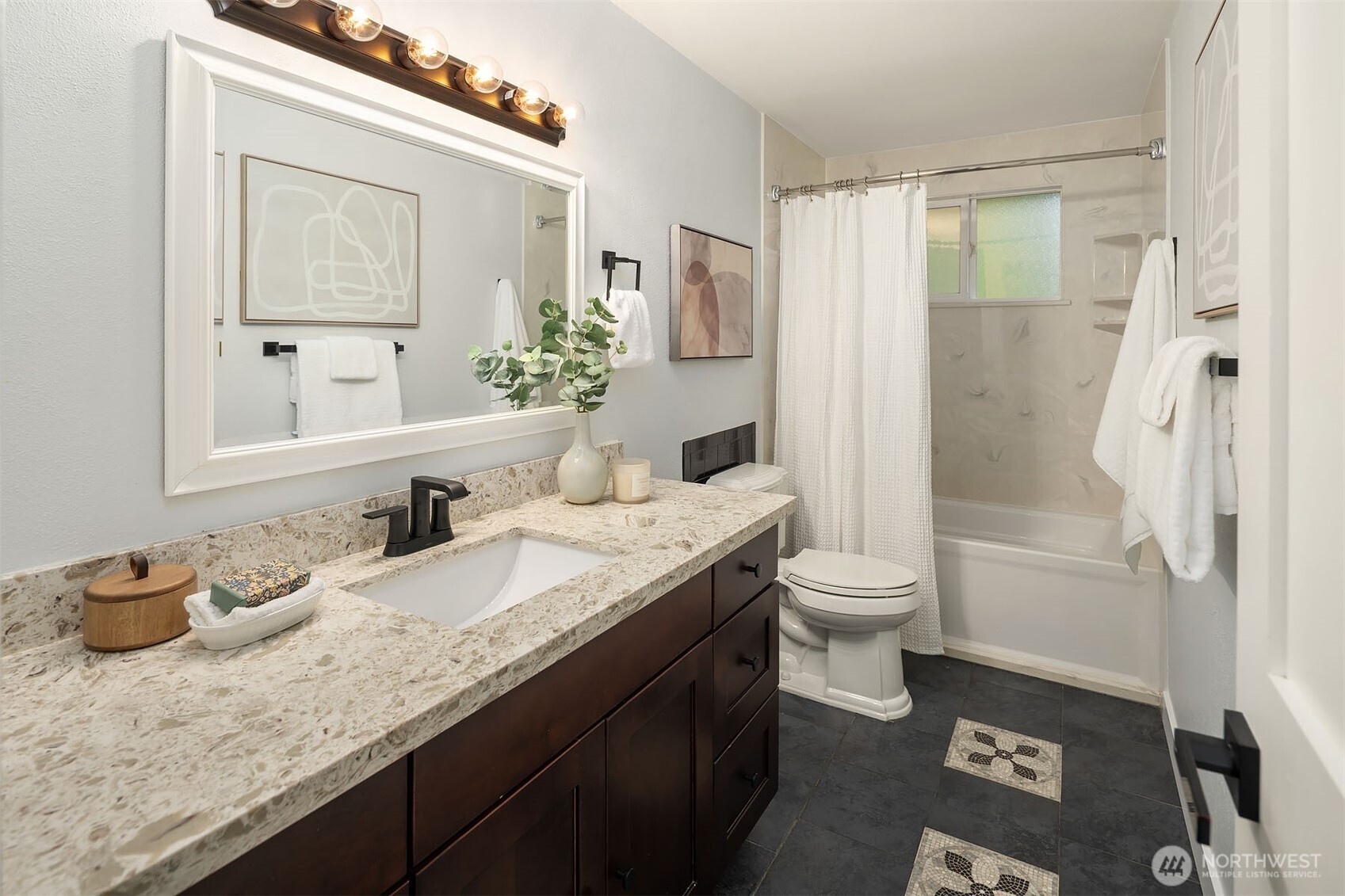10017 Northeast 202nd Street Bothell, WA 98011 - Photo 17 of 38 a bathroom with a granite countertop sink toilet and shower