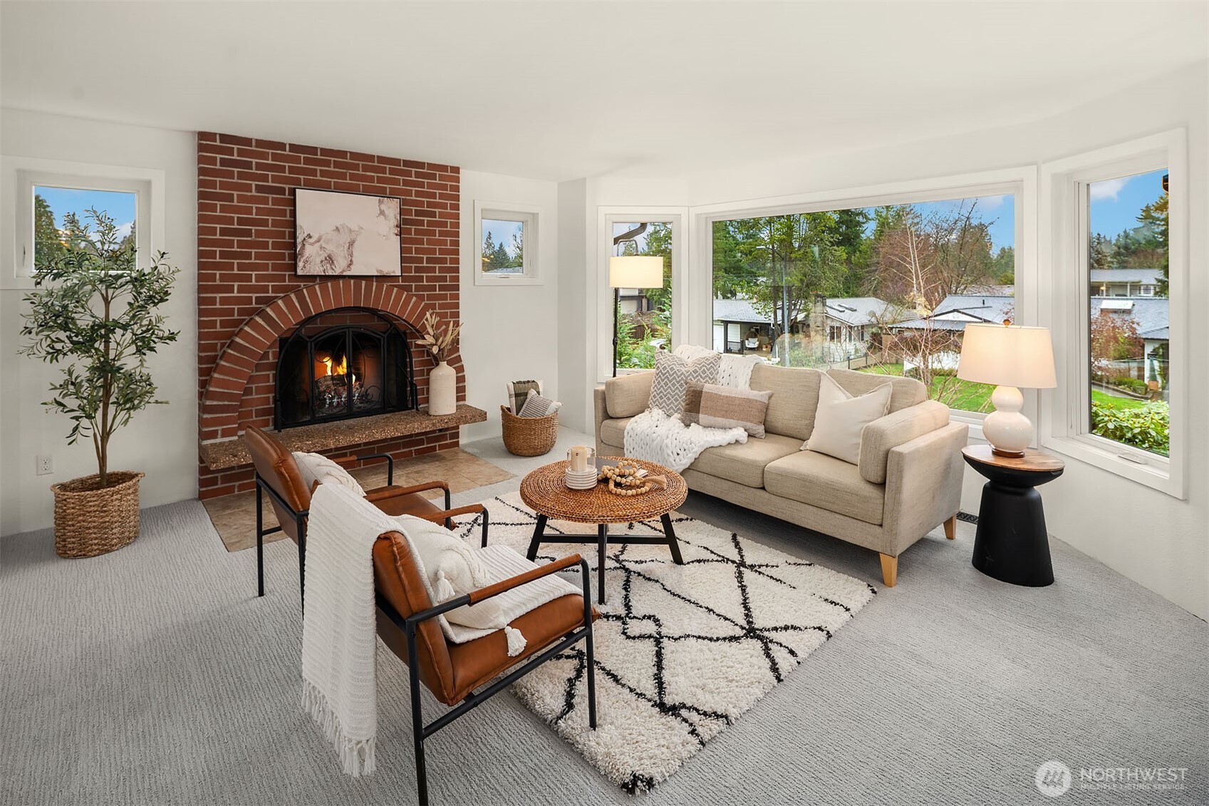 10017 Northeast 202nd Street Bothell, WA 98011 - Photo 2 of 38 a living room with furniture and a fireplace