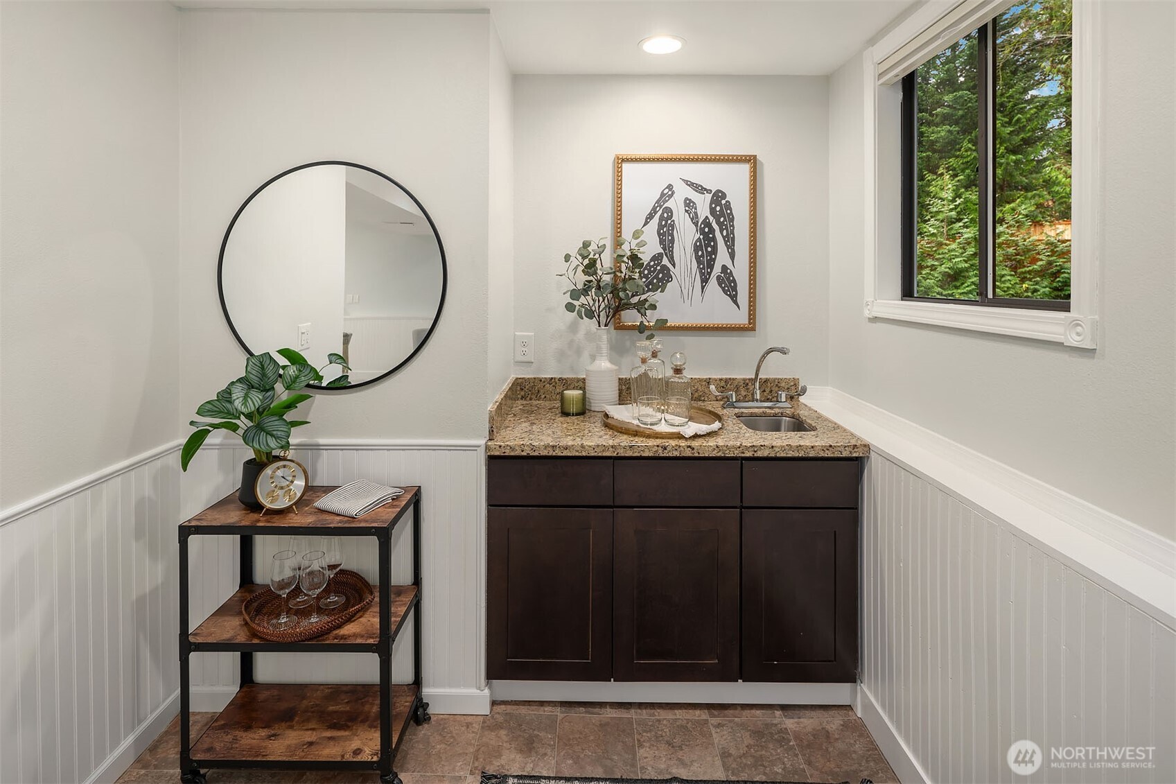 10017 Northeast 202nd Street Bothell, WA 98011 - Photo 22 of 38 a bathroom with a sink a mirror and a window