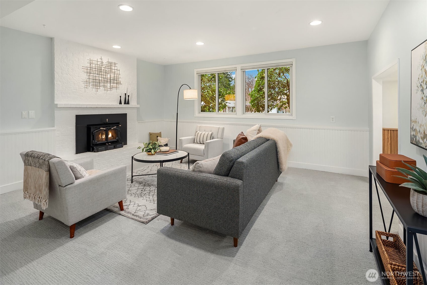 10017 Northeast 202nd Street Bothell, WA 98011 - Photo 24 of 38 a living room with furniture and a fireplace