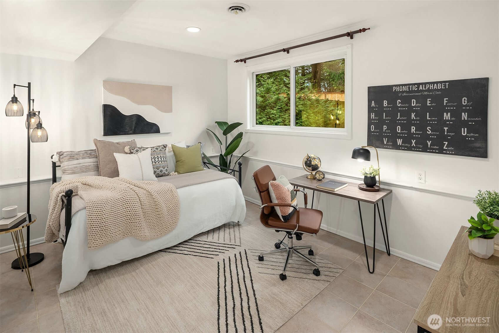 10017 Northeast 202nd Street Bothell, WA 98011 - Photo 26 of 38 a living room with a couch and a potted plant