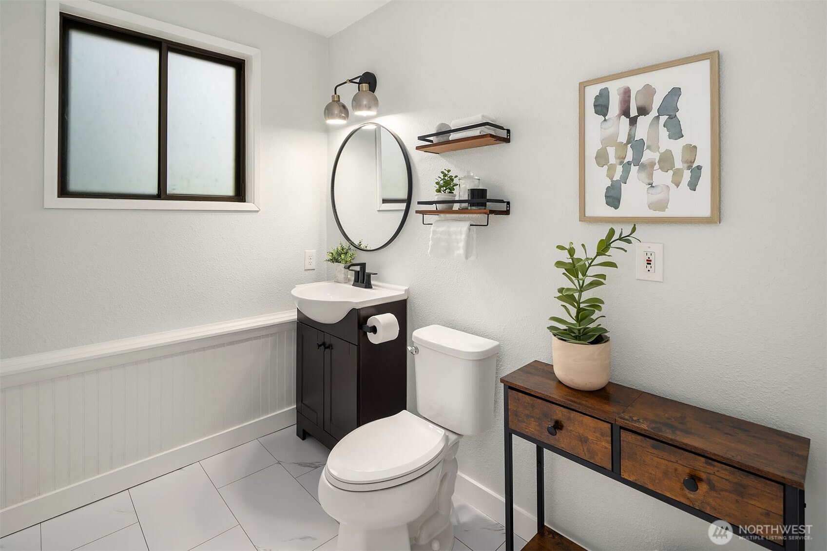 10017 Northeast 202nd Street Bothell, WA 98011 - Photo 27 of 38 a bathroom with a toilet a sink and a mirror