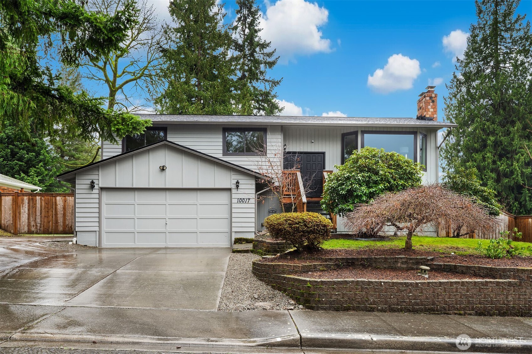 10017 Northeast 202nd Street Bothell, WA 98011 - Photo 38 of 38 a front view of a house with a yard and garage