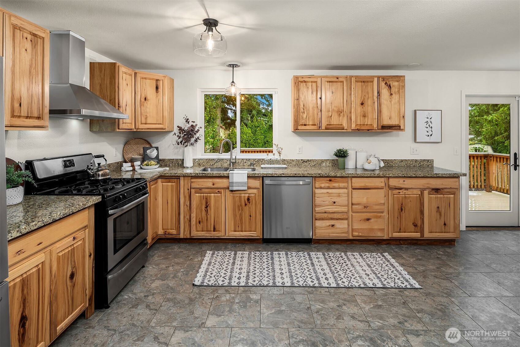 10017 Northeast 202nd Street Bothell, WA 98011 - Photo 9 of 38 a kitchen with a sink stove and cabinets