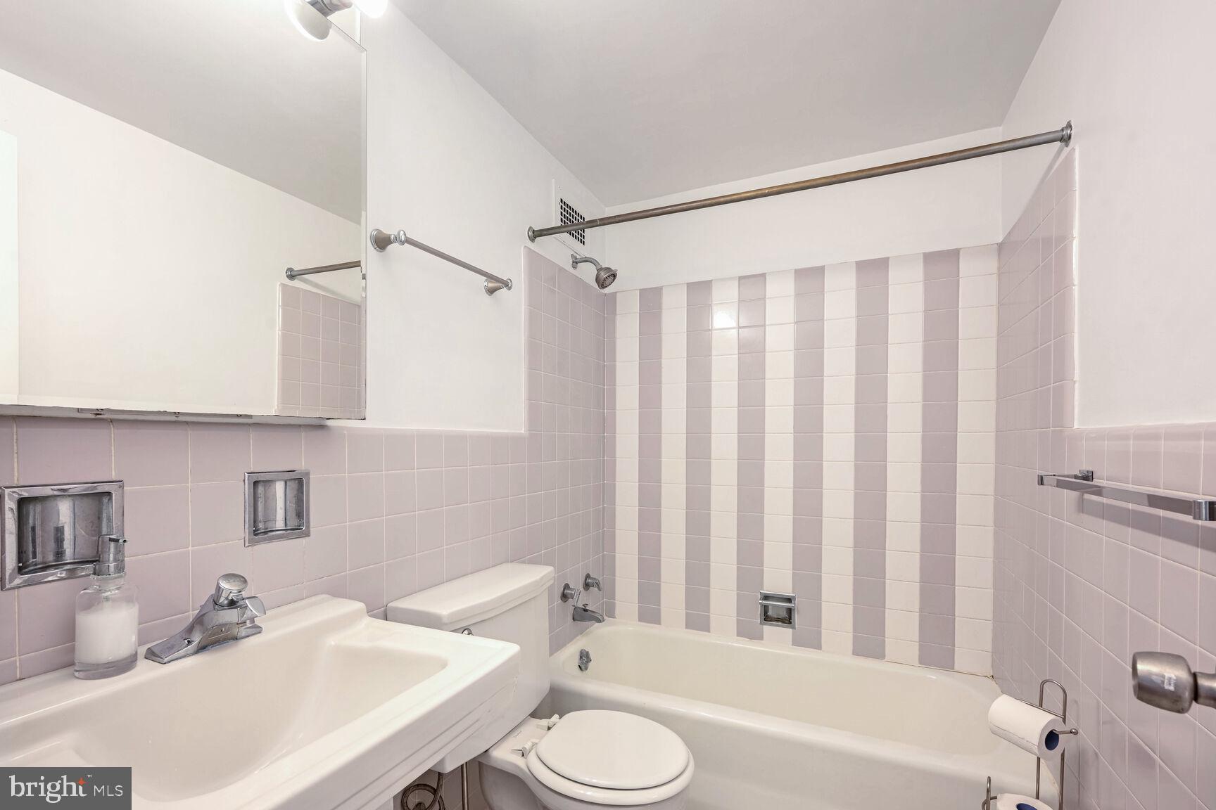 2475 Virginia Avenue Northwest, Unit 814 Washington, DC 20037 - Photo 13 of 29 a bathroom with a sink toilet and shower