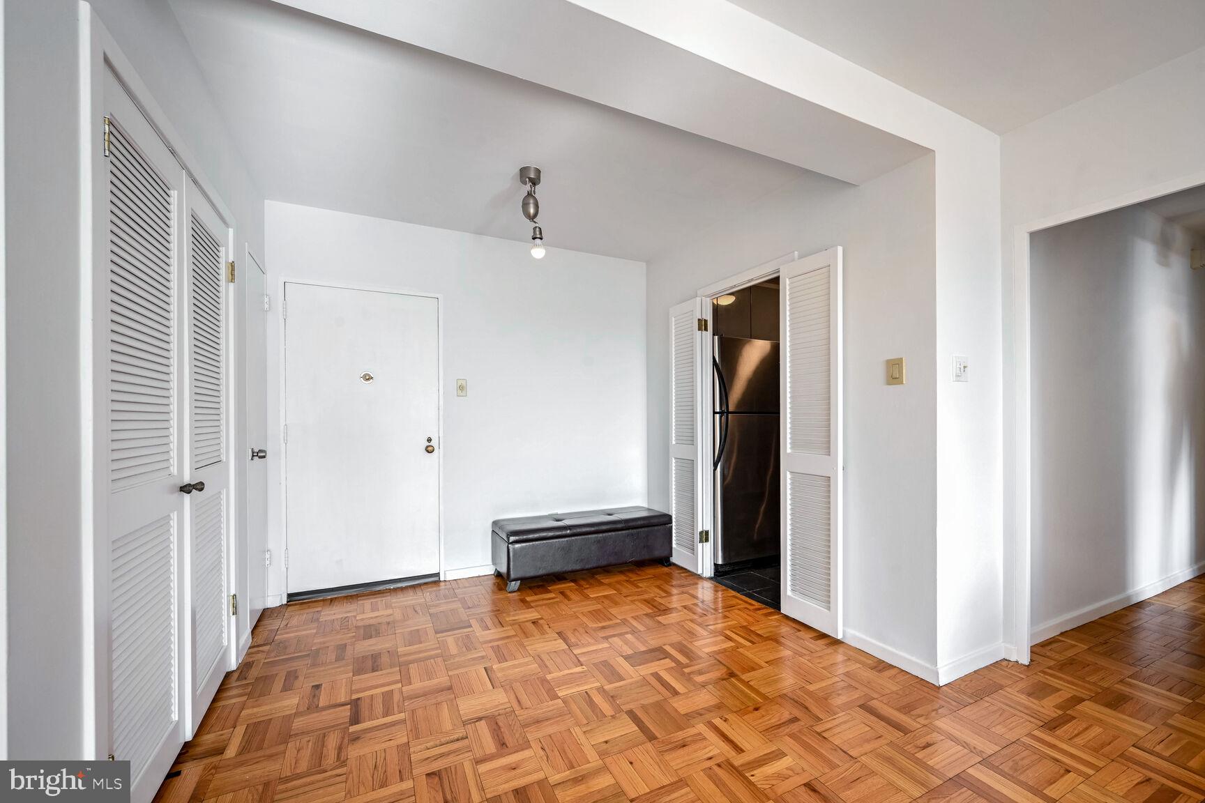 2475 Virginia Avenue Northwest, Unit 814 Washington, DC 20037 - Photo 14 of 29 a bedroom with a bed and a walk in closet