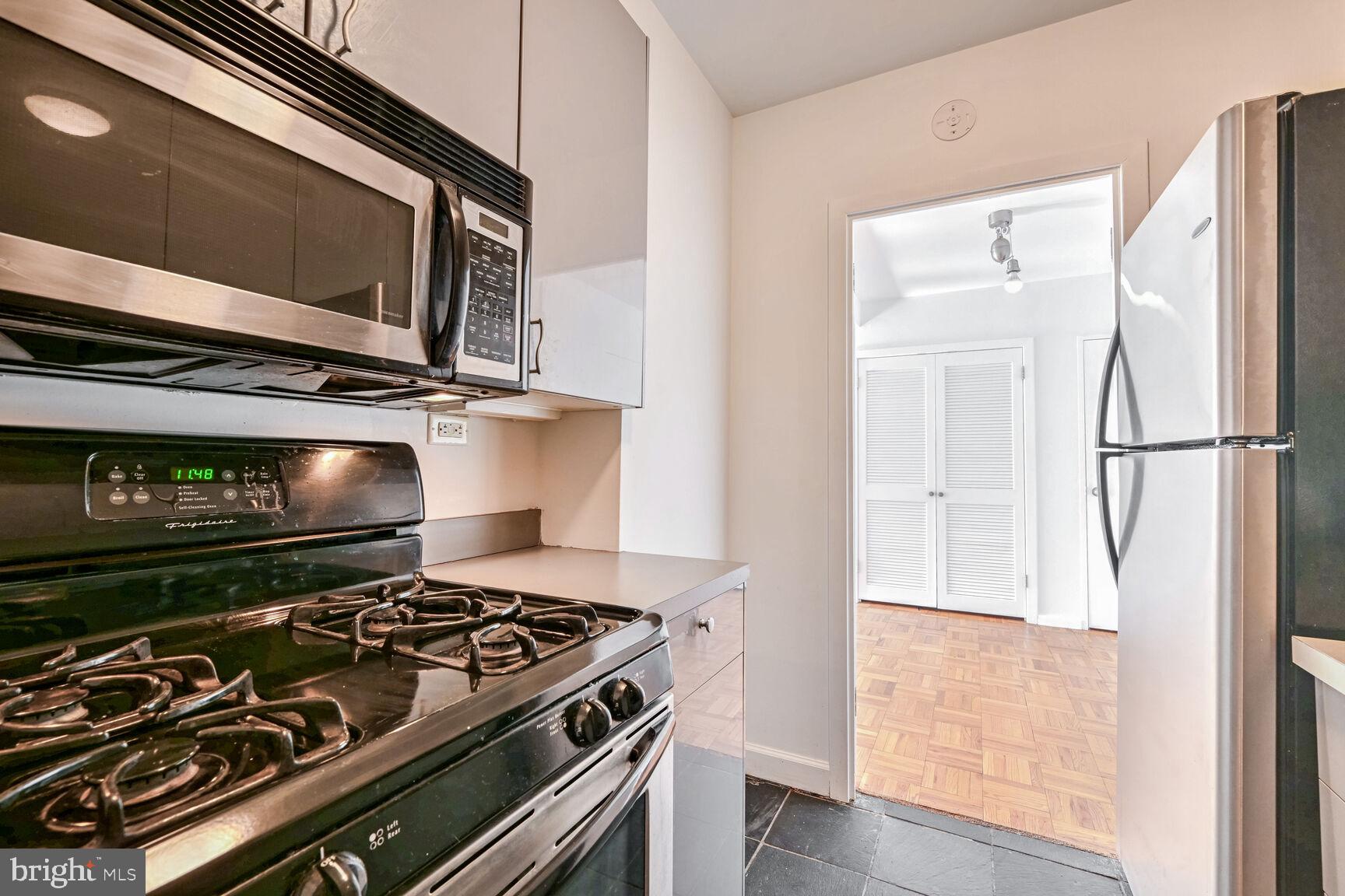 2475 Virginia Avenue Northwest, Unit 814 Washington, DC 20037 - Photo 9 of 29 a stove top oven sitting inside of a kitchen