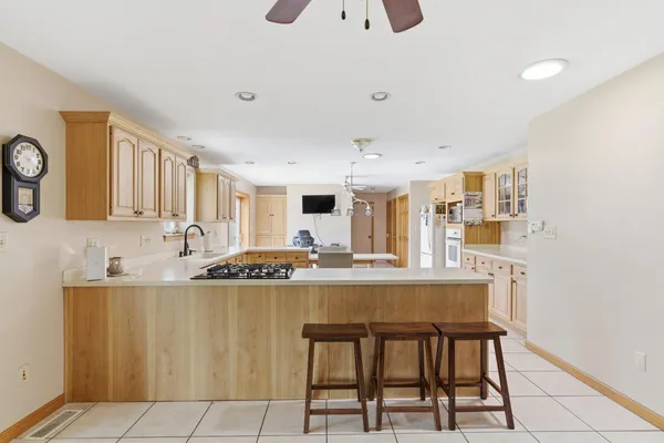 a kitchen with stainless steel appliances granite countertop a sink and cabinets