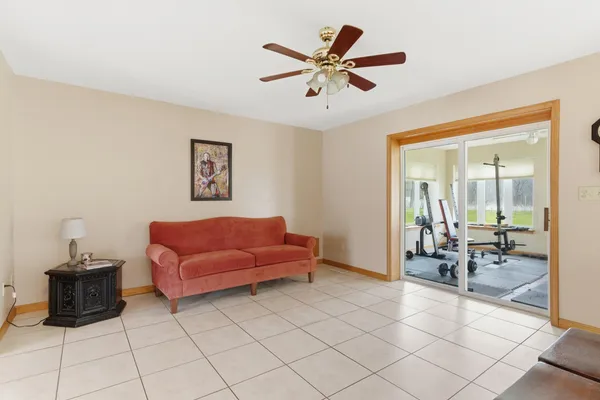 a living room with furniture and a view of dining room