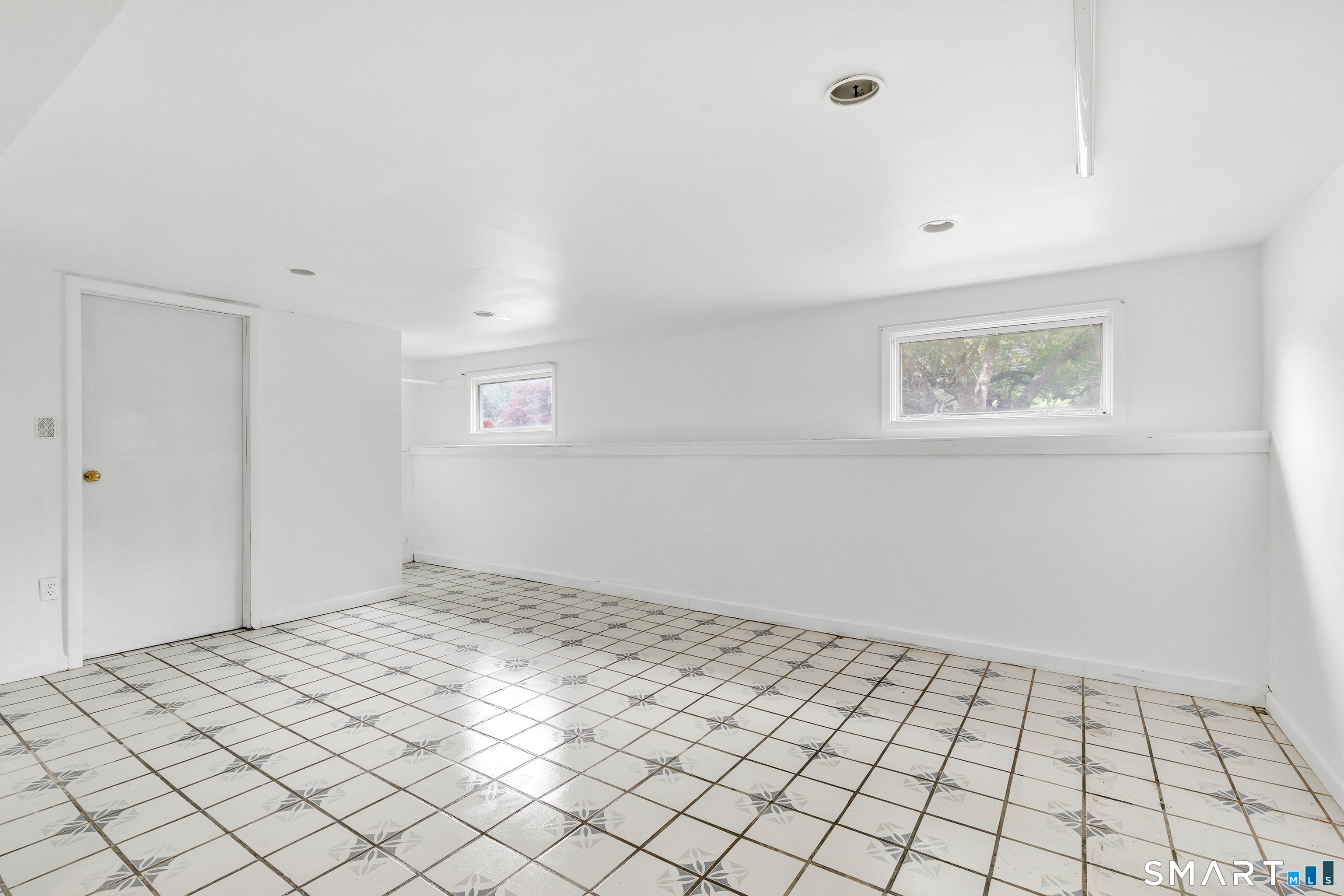 17 Woodlawn Road Monroe, CT 06468 - Photo 34 of 37 Finished lower level with bathroom offers a versatile space perfect for play, fitness, or a quiet work-from-home office