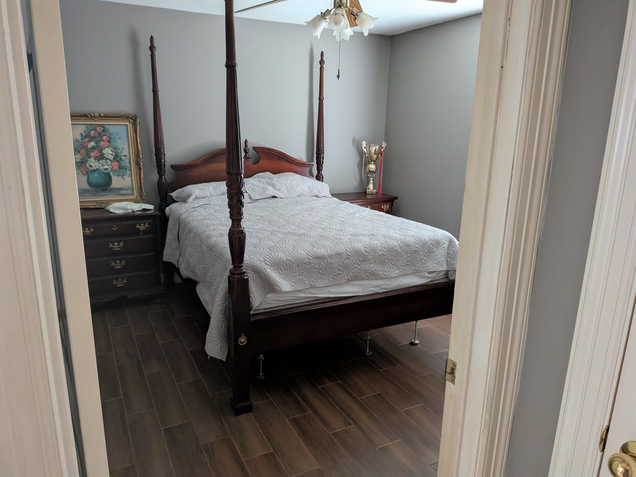 13107 Walnut Lake Road Houston, TX 77065 - Photo 19 of 21 a bed sitting in a bedroom next to a bathroom