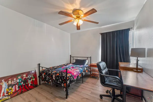 a bedroom with furniture and a window