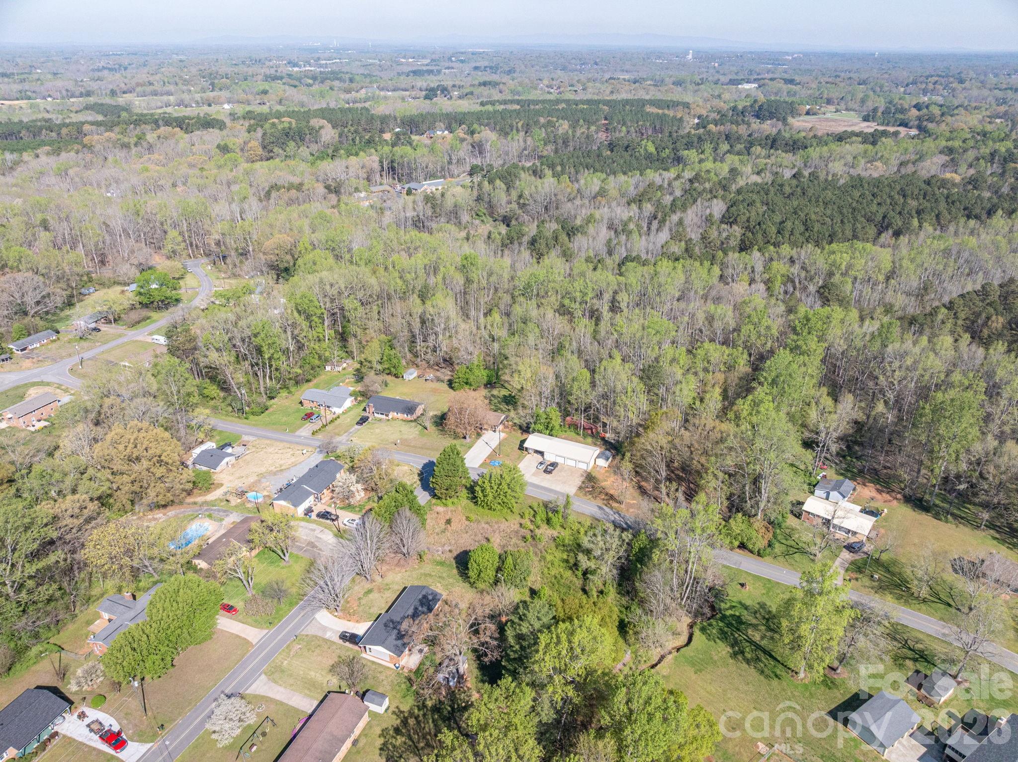 5101 Ridge Street Shelby, NC 28152 - Photo 17 of 21 a view of a field with trees in the background