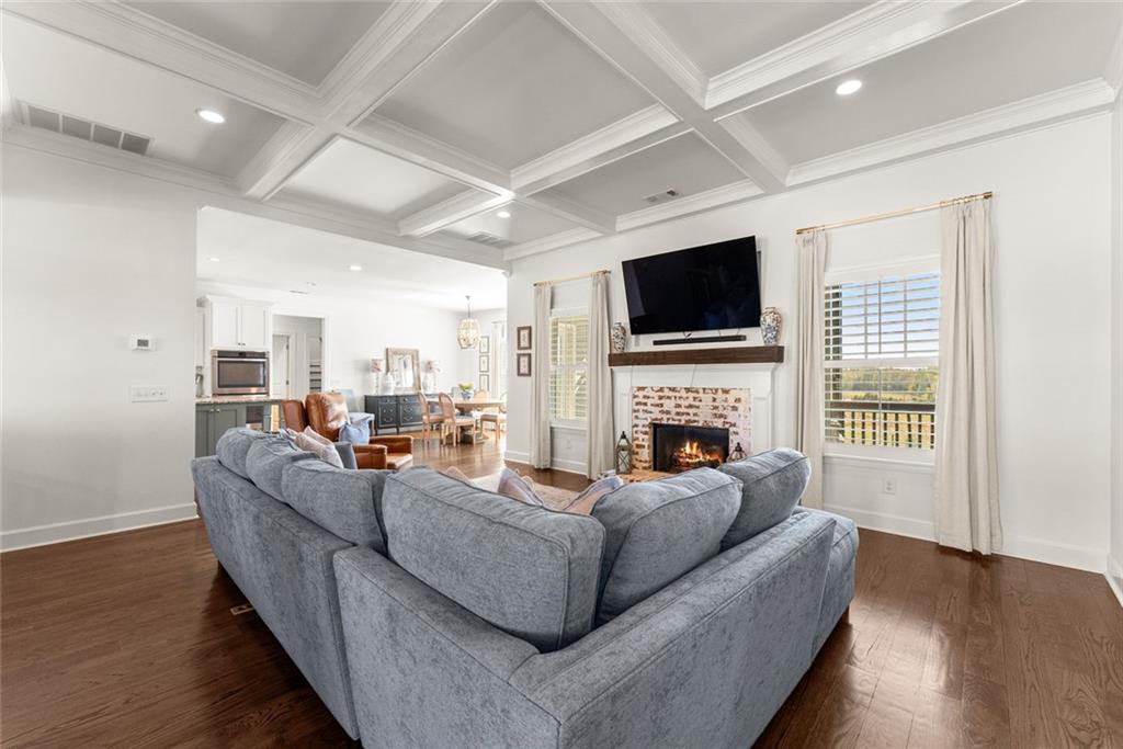 360 Clear View Court Clermont, GA 30527 - Photo 11 of 53 a living room with fireplace furniture and a flat screen tv