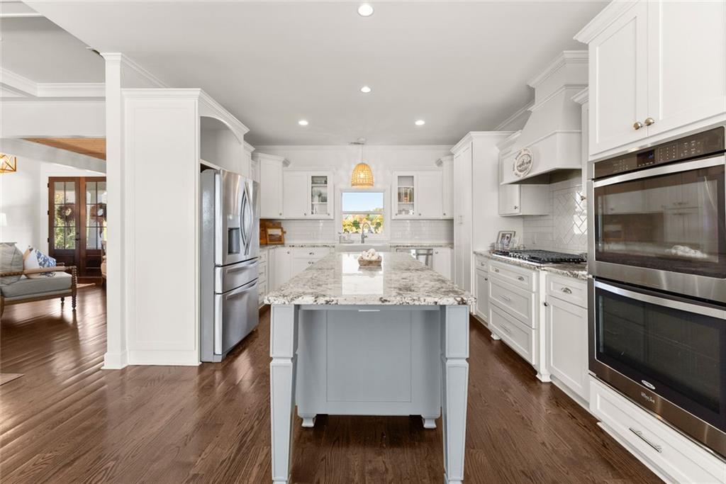 360 Clear View Court Clermont, GA 30527 - Photo 16 of 53 a kitchen with stainless steel appliances a stove a sink and a refrigerator