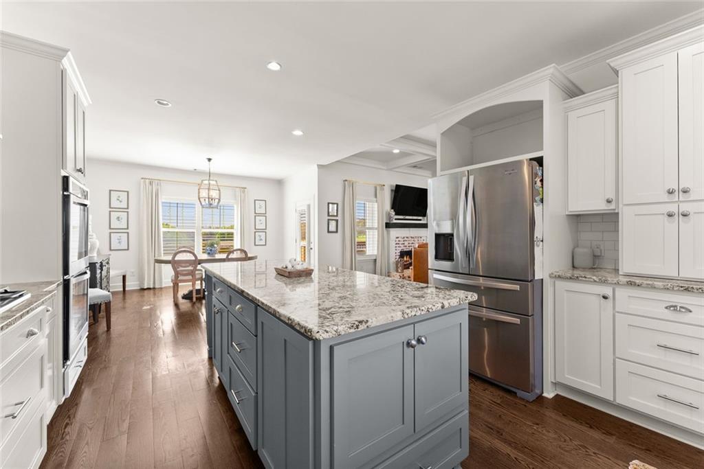 360 Clear View Court Clermont, GA 30527 - Photo 19 of 53 a kitchen with stainless steel appliances granite countertop a refrigerator a stove and a sink