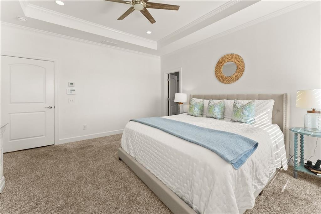 360 Clear View Court Clermont, GA 30527 - Photo 22 of 53 a bedroom with a bed and a ceiling fan